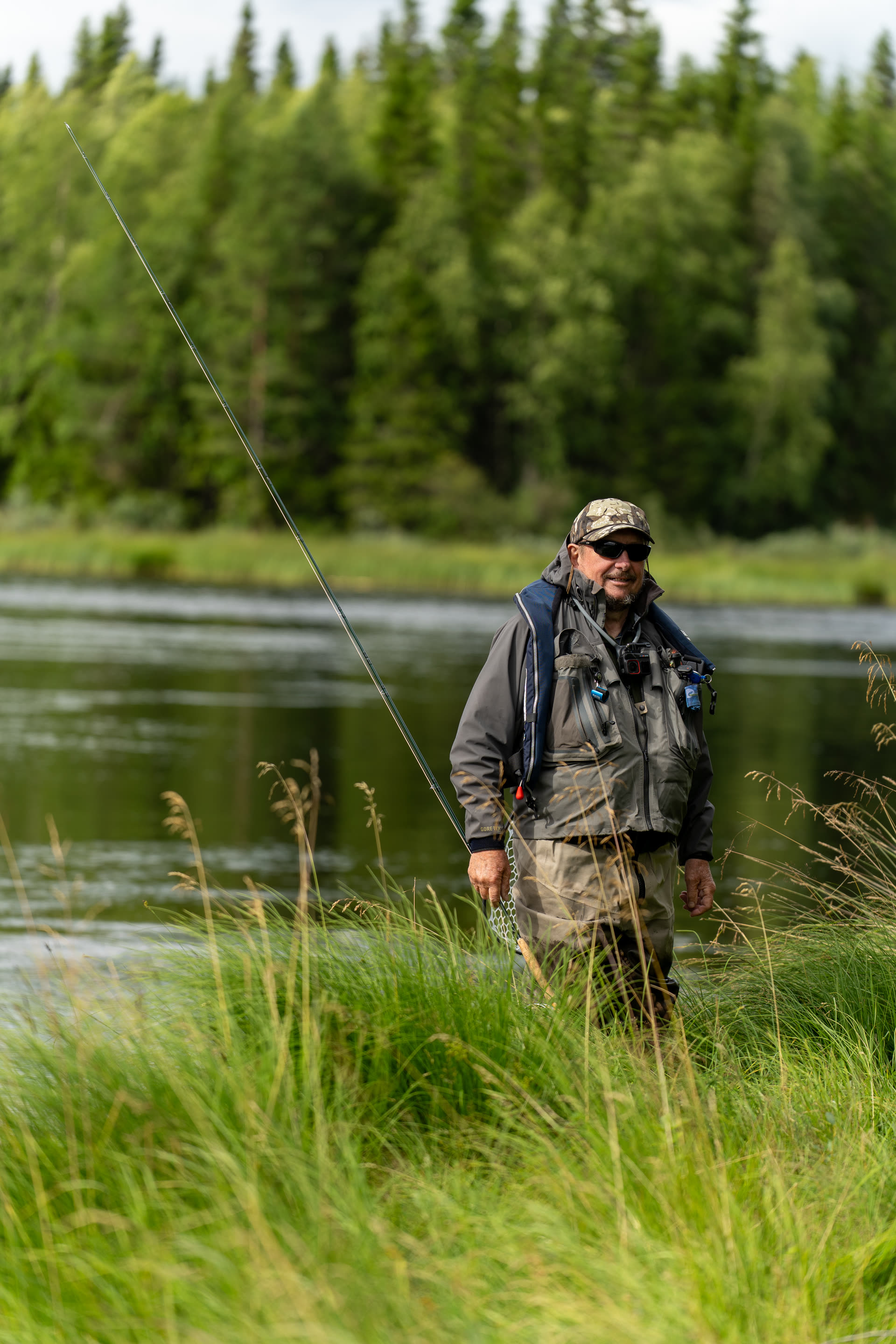 Gennadi wading a Lapland river