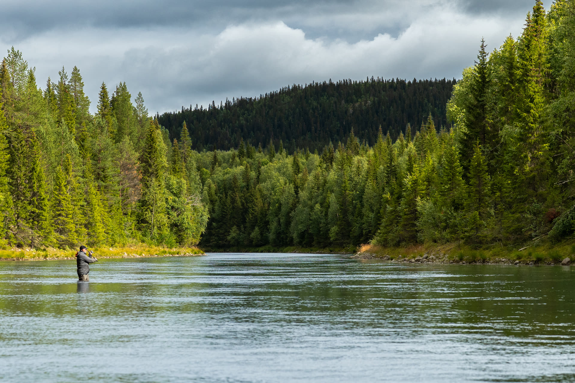 Spin fishing from the boat on a Lapland lake