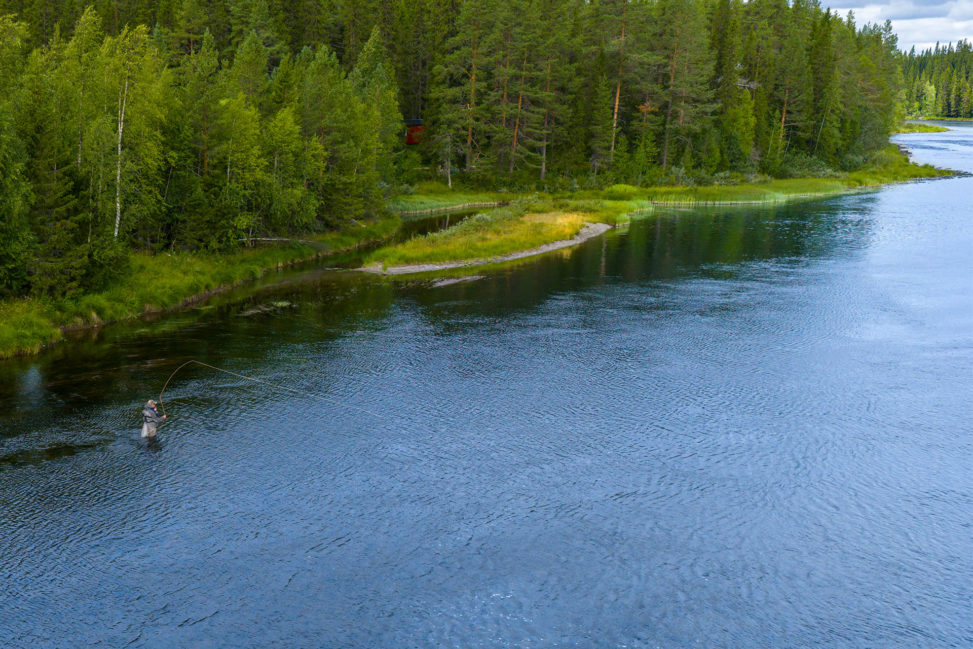 Fly line in the air over a Lapland river